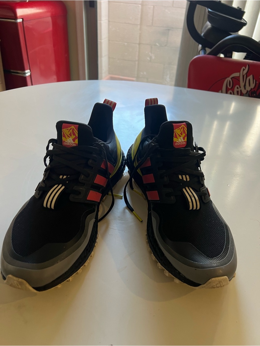 adidas adult Black Sneakers with Red and Yellow Accents